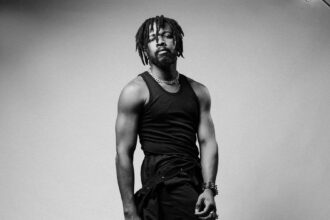 Johnny Drille reacts to fan who just found out he has a child