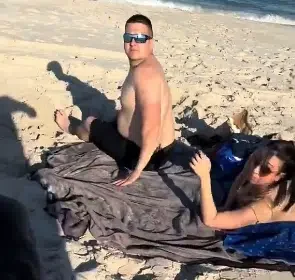 Moment 9-month pregnant woman catches her husband with side chic on the beach
