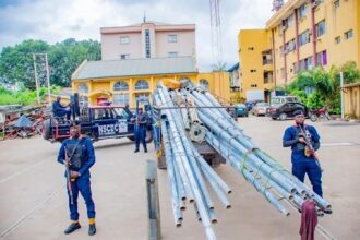 Driver And Motor Boy Flee as NSCDC Intercepts Truck Loaded With Stolen Street Light Poles in Abuja