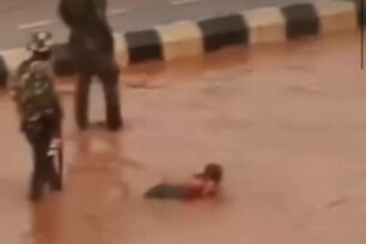 Nigerian Soldiers Force Driver to Swim In Muddy Water In Enugu After His Vehicle Splashed Water on Them (Video)