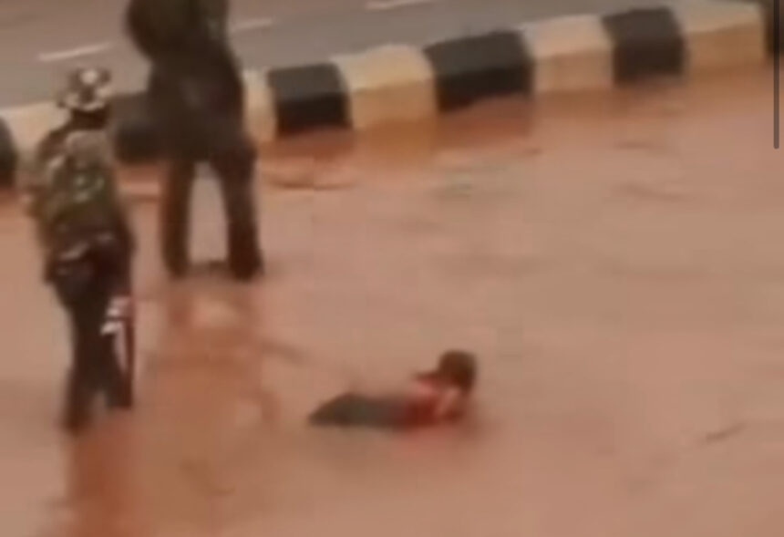 Nigerian Soldiers Force Driver to Swim In Muddy Water In Enugu After His Vehicle Splashed Water on Them (Video)