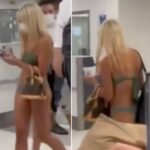 Shock As Woman Strolls Through An Airport Wearing Just A Bikini And Face Mask (Photos)