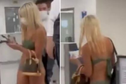Shock As Woman Strolls Through An Airport Wearing Just A Bikini And Face Mask (Photos)