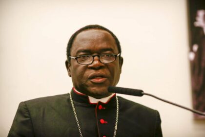 Kukah has changed politically, owes Buhari apology – Fr Kelvin