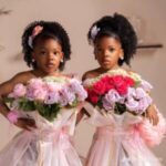 Mom shares creative way she styled her twin girls as flower bouquets for their birthday photoshoot.