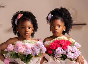 Mom shares creative way she styled her twin girls as flower bouquets for their birthday photoshoot.