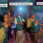Drama as groom slaps lady after she packed money sprayed on him during wedding dance