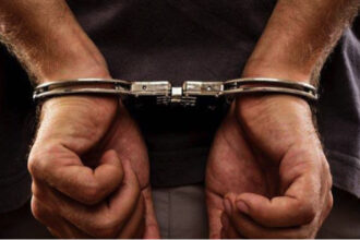Man in handcuffs used to illustrate the story