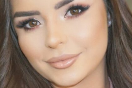 Demi Rose Leans Over Bathroom Sink In Undone String Bikini