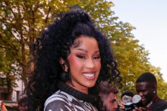 Cardi B In Pink Mini Dress Sparks ‘New Face’ Speculation