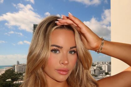 Emily Elizabeth Mesmerizes In A Black String Bikini At The Beach