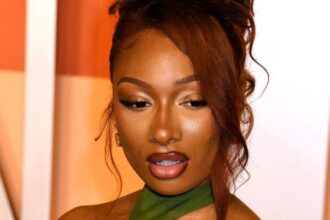 Megan Thee Stallion Poses With Wolf In Barely-There Fit: ‘Epic AF’