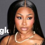 Yung Miami In Plunging Sheer Dress Told She Looks ‘Different’