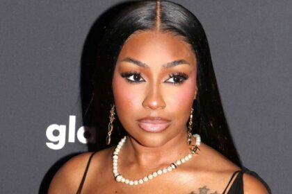 Yung Miami In Plunging Sheer Dress Told She Looks ‘Different’