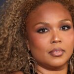 Lizzo Braless In Plunging Dress With Hip-High Slit Sparks Thirst