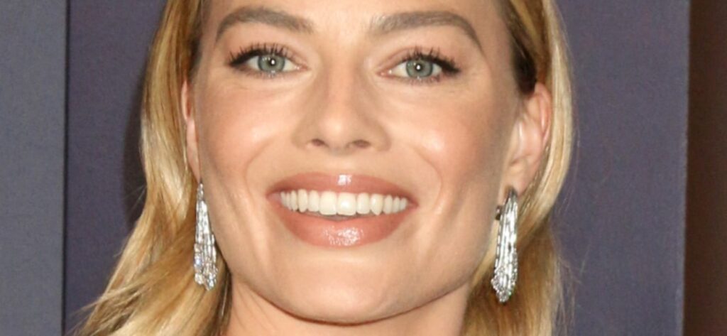 Margot Robbie Shows ‘Unreal Thighs’ In Unbuttoned Swimsuit In Hawaii Ocean